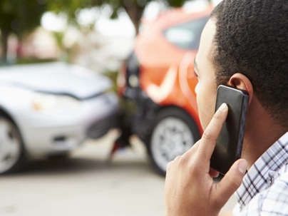 a man on the phone after a car accident